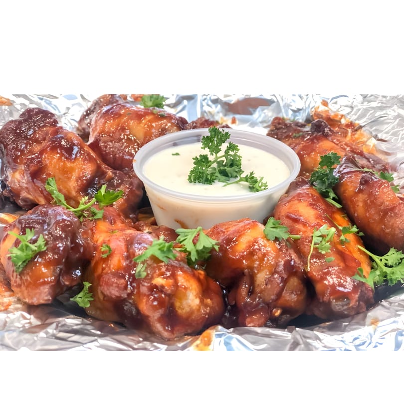 Cappy's Pizza & Subs BBQ chicken wings with parsley garnish and a side of ranch dressing.